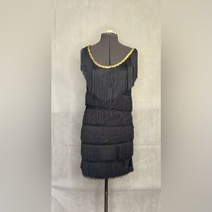 Black flapper dress with gold detail at caller
